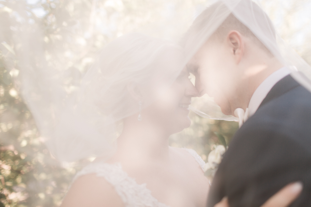 bride and groom under veil | elegant wedding in sunny apple orchard | best hawaii wedding photographer oahu elopement photography elle rose photo