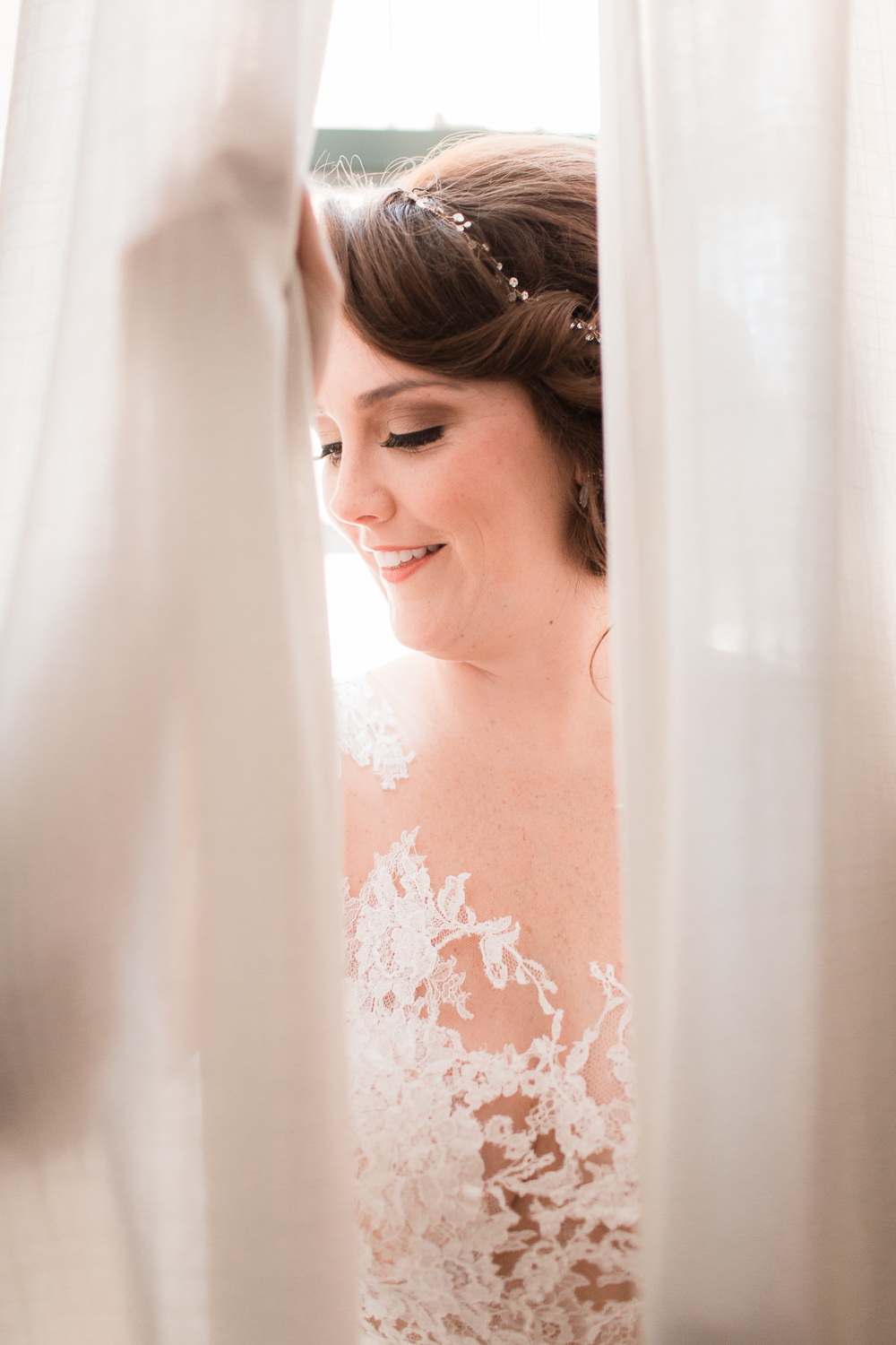 bride peeking through curtain summer wedding florals natural sage | hawaii elopement photography | elle rose photo hawaii wedding photographer