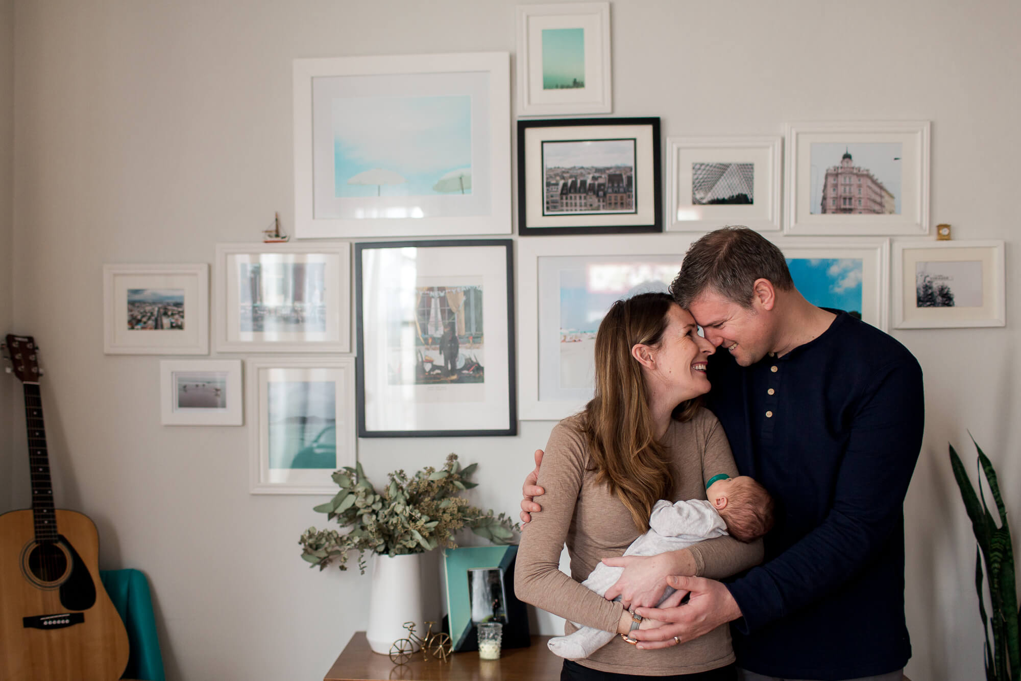gallery wall happy new parents | hawaii family oahu newborn kailua photography elle rose photo in home lifestyle session with baby in stylish house