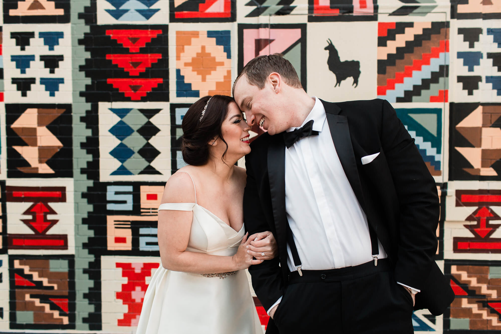 bride and groom in front of geometric pattern | romantic elegant city wedding photography elle rose | oahu hawaii wedding photographer| destination black tie winter wedding in chicago illinois