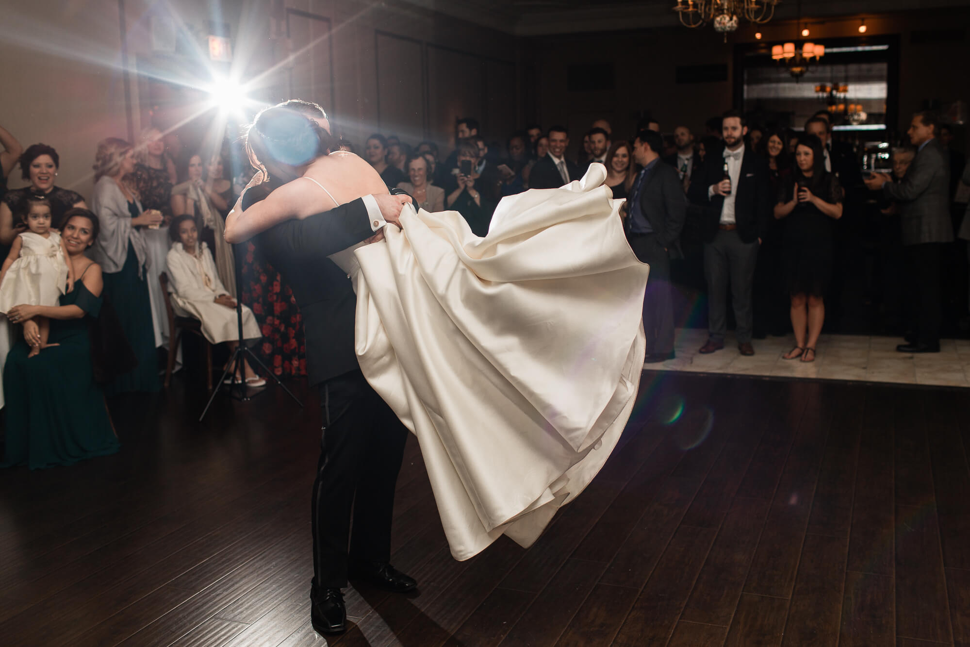 bride lifted in the air during first dance