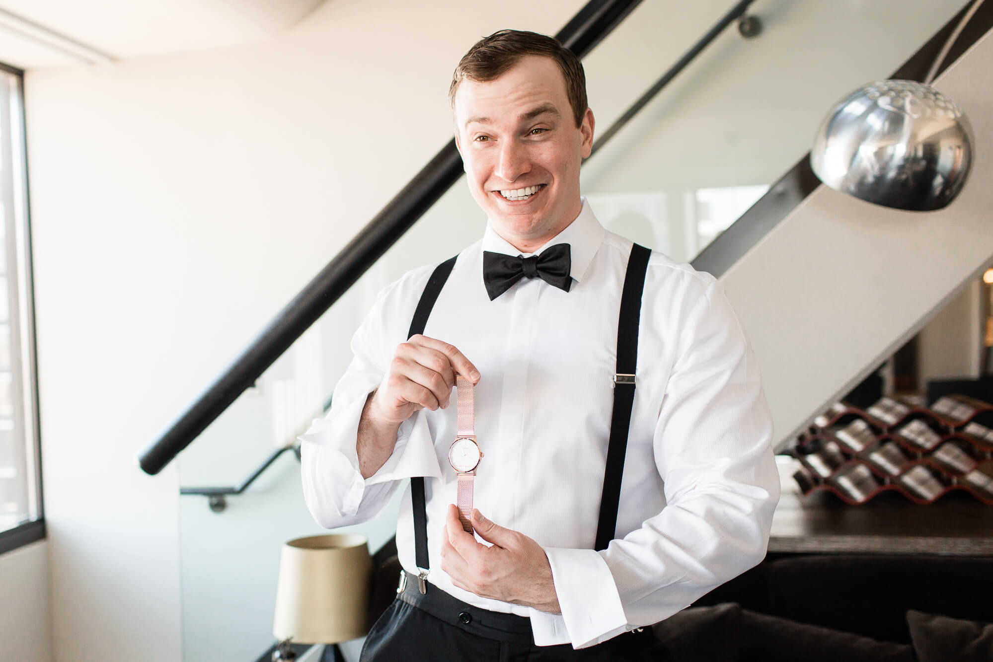 oahu wedding hawaii family photography elle rose photo | glamorous destination winter wedding at thompson chicago | groom holding pink watch