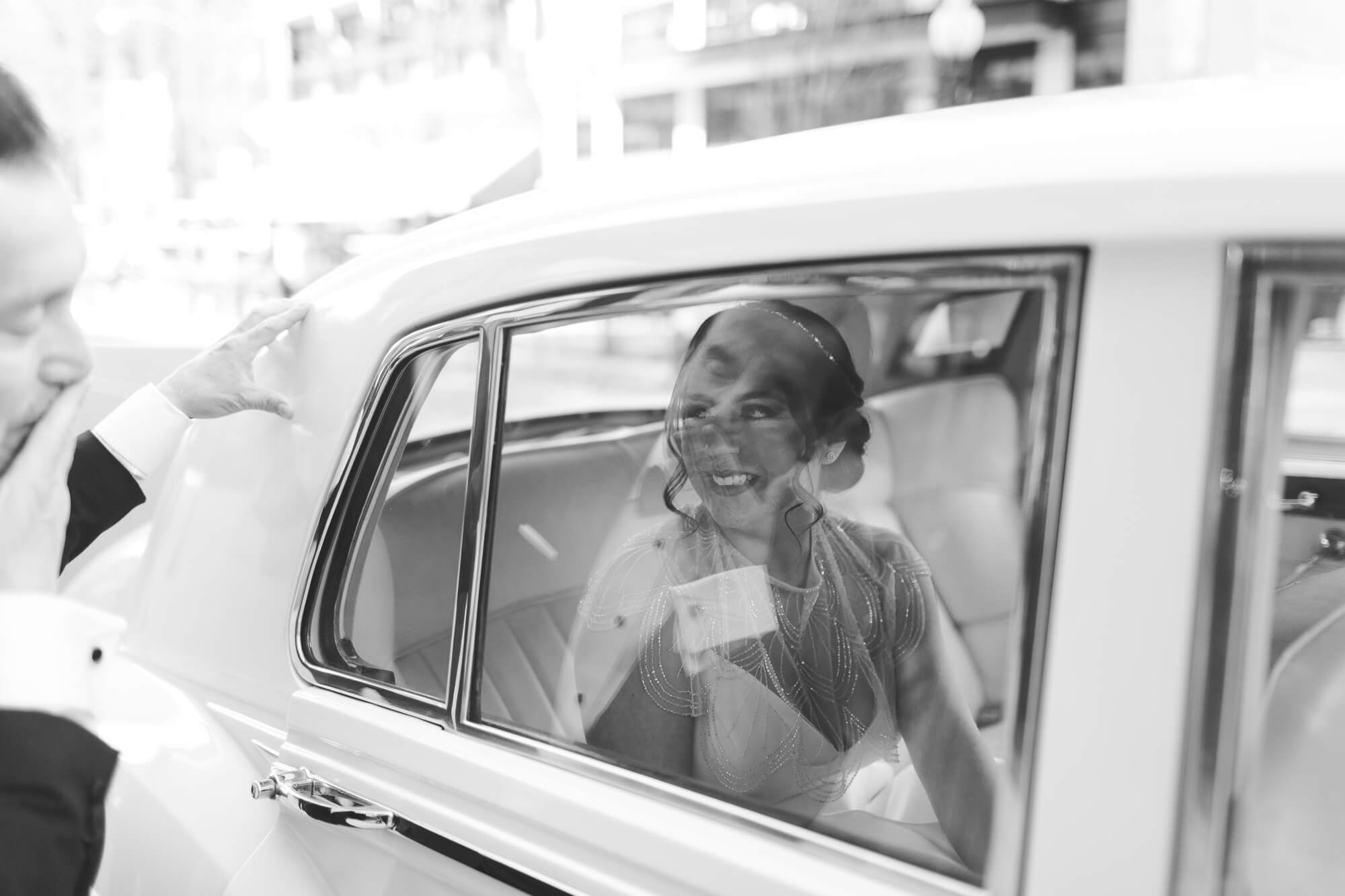 bride through car door on wedding day | oahu wedding hawaii family photography elle rose photo | glamorous destination winter wedding at thompson chicago 