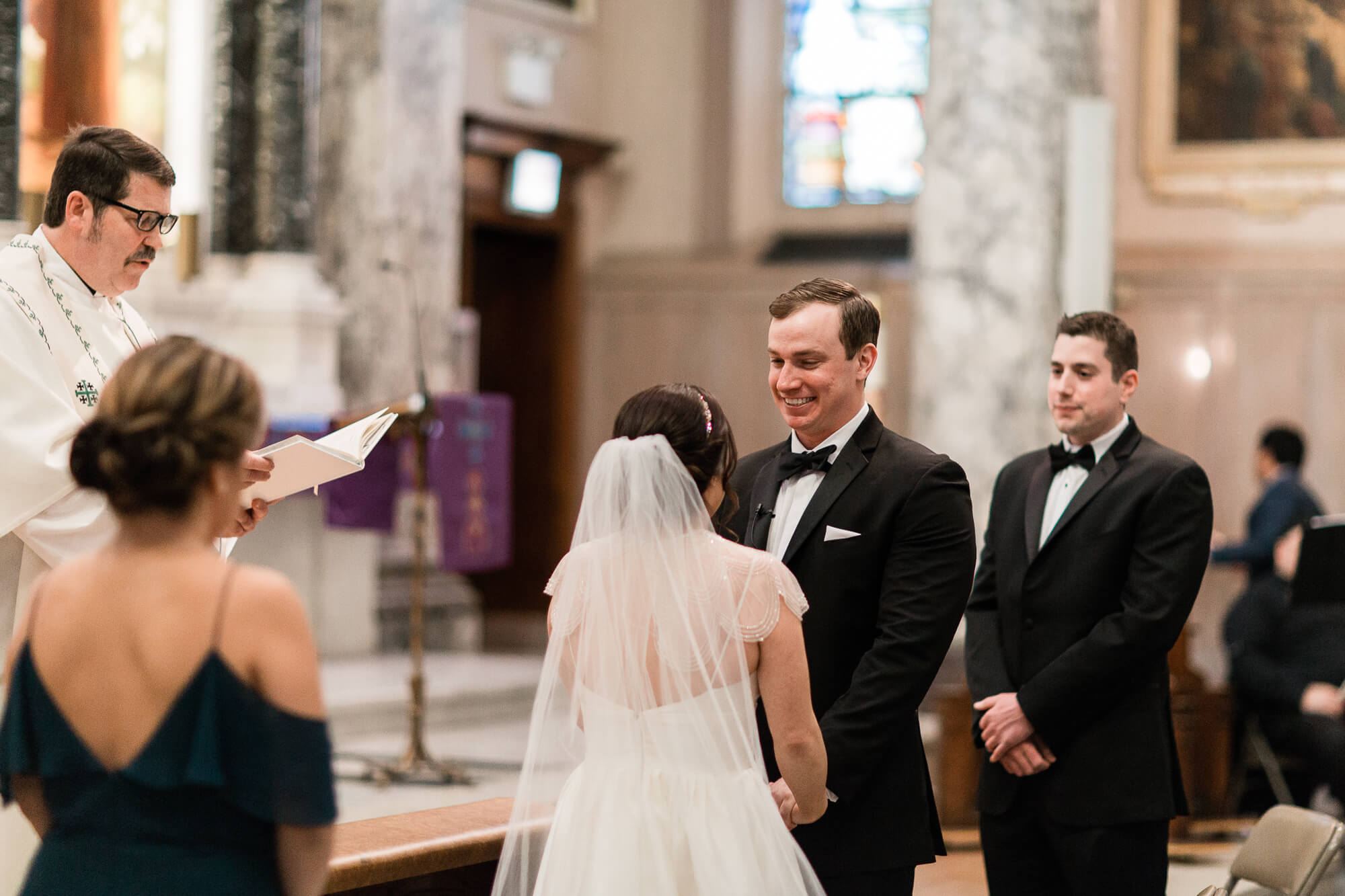 groom smiling at bride on wedding day | hawaii black tie wedding oahu family photography elle rose photo | glamorous destination winter wedding at thompson chicago 