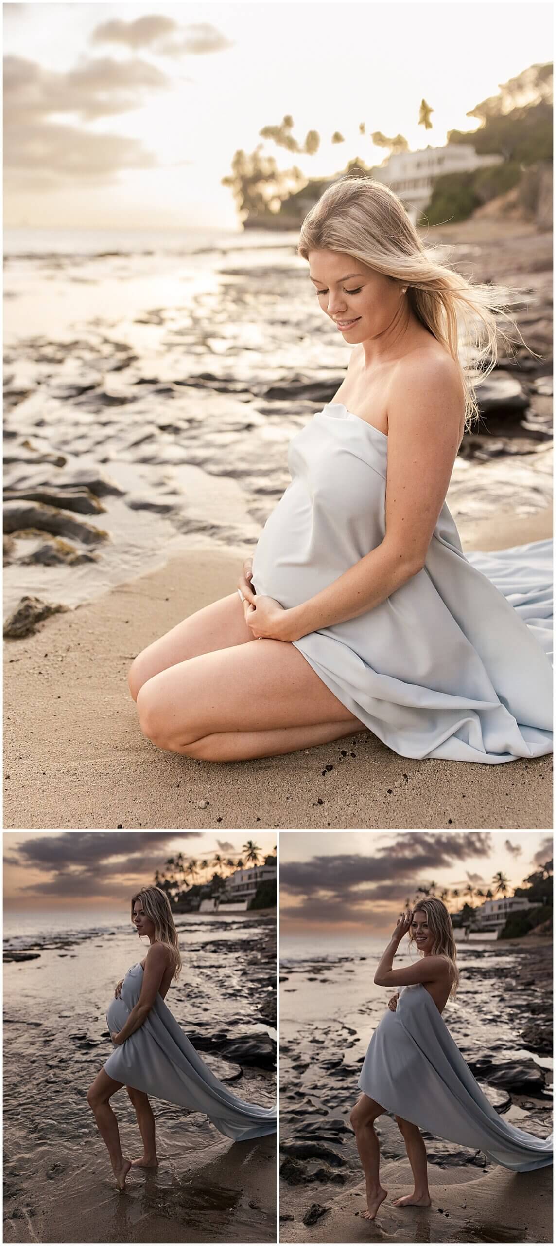 New mother kneeling in the sand wearing Long train gown with wind blowing in her hair by Oahu lifestyle photographer