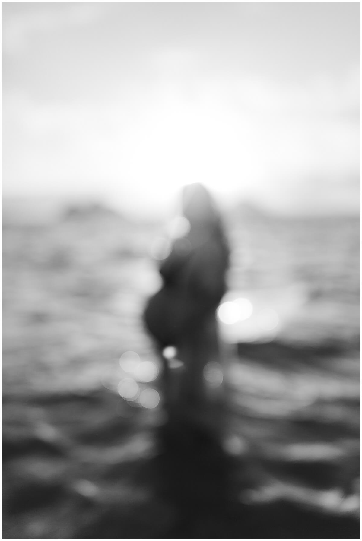 out of focus sunrise maternity of mother in water by Elle rose photo