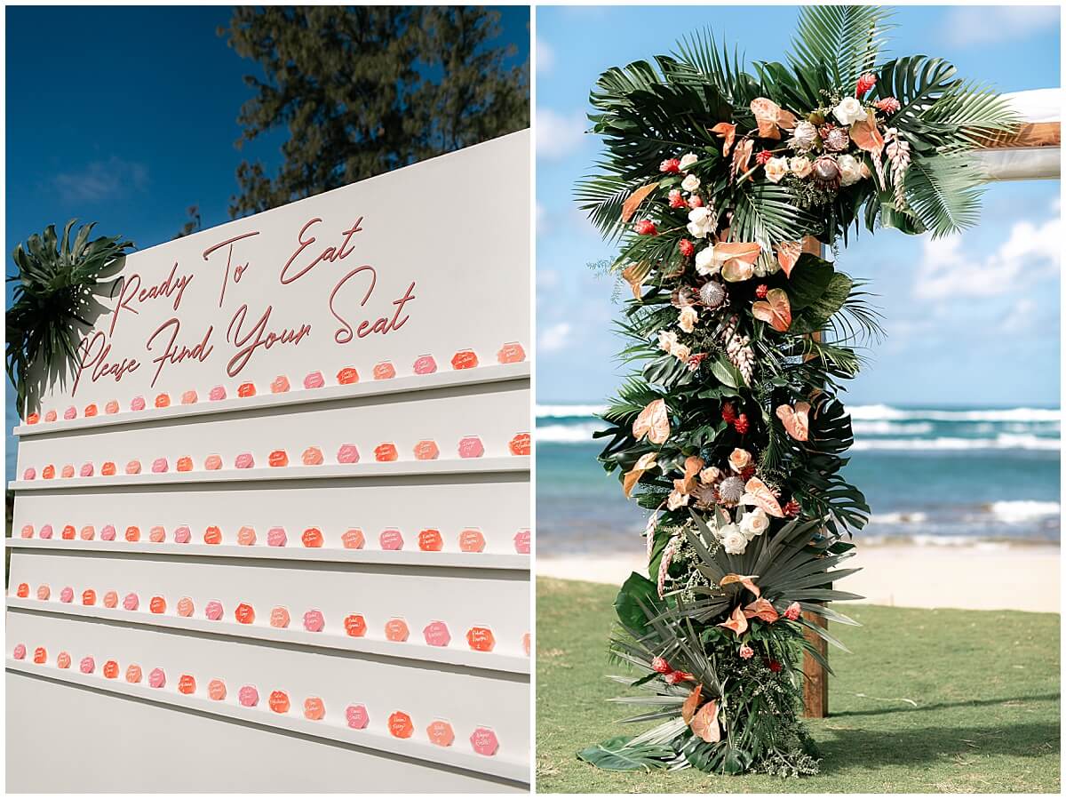 multicolor seating chart and ceremony arch display with florals by Oahu wedding photographer 