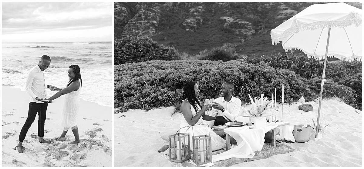 newly engaged couple sitting on picnic set up on the beach by oahu engagement photographer