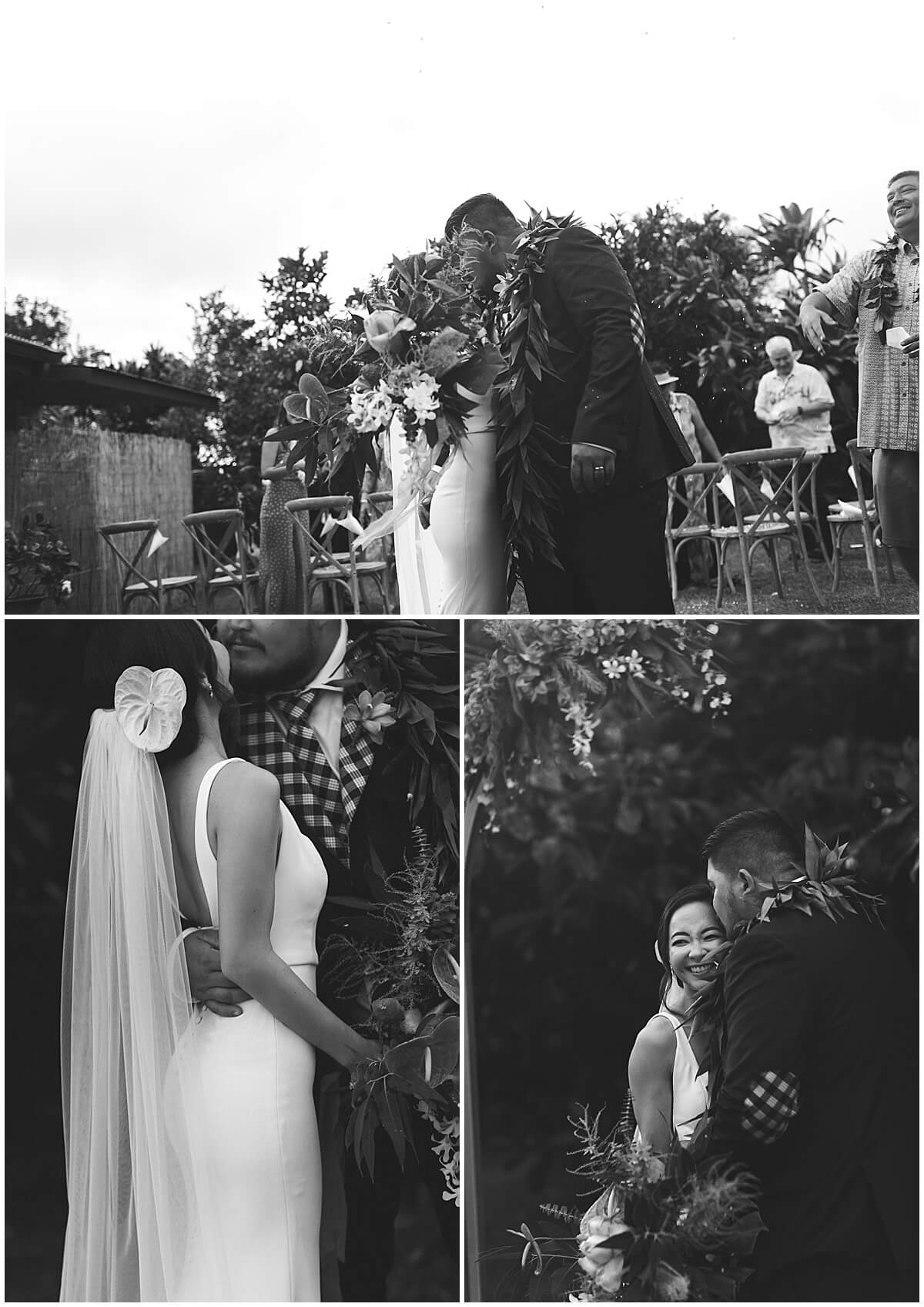 groom holding bride around waist under greenery by oahu wedding photographer 